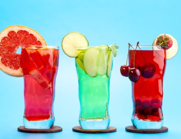 front-view-fresh-fruit-cocktails-with-fresh-fruit-slices-ice-cooling-blue-drink-juice-cocktail-fruit-color (1)